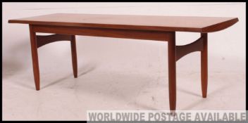 A good Danish 1970's retro teak sideboard being raised on tapered legs with chamfered edge