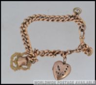 An 9ct gold antique watch chain strung with a 9ct gold front & back heart shaped locket together