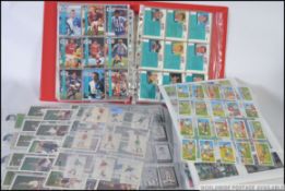 A large collection of various cigarette and bubblegum cards all pertaining to football,