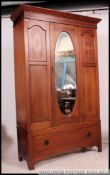 An Edwardian mahogany inlaid single wardrobe.