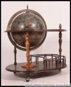 An antique style 20th century globe drinks cabinet trolley.