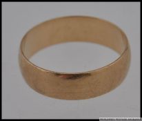 A 9ct gold gentlemans band ring being hallmarked with makers initials WJJ. Total weight 3.