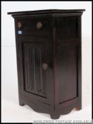 An early 20th century Jacobean revival oak side cabinet.
