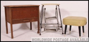 A vintage 1950's hinged top sewing box together with a retro pouffe on dansette legs and a retro
