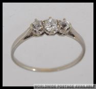A 9ct gold and diamond single 3 stone ladies ring, the diamonds approx 30pnts. Weight 1.