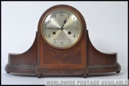 A 20th century Napoleon hat mantel clock having 14 day chime movement in working condition