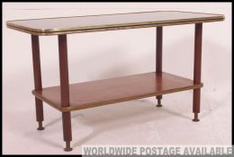 A vintage / retro mid century glass painted top coffee table having a backgammon inspired design