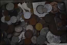 A collection of coins from around the world to include British,