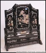 A 19th century mother of pearl and ebony Chinese screen / discretion panel.