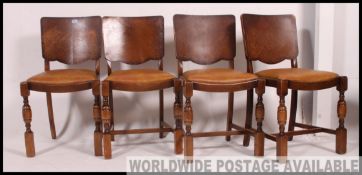 A set of 4 early 20th century Art Deco 1930's panel back dining chairs raised on squared legs with