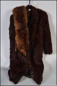 A vintage ladies fur coat and fur stole.