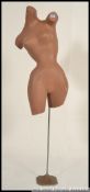 A vintage / retro posed point of sale shop advertising female mannequin's torso dummy,