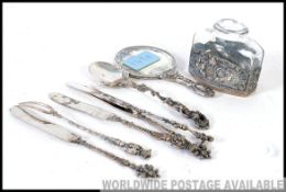 A collection of continental silver and white metal items to include a Dutch silver christening