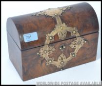 A 19th century burr walnut and silver overlaid jewellery casket.