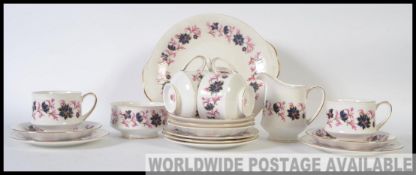 A 20th century Chintz pattern part tea service by Paragon.
