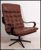 A stunning leather and bentwood swivel armchair in the Danish manner.