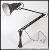 An early Herbert Terry bench mounted industrial workers anglepoise lamp, with original crabtree top.