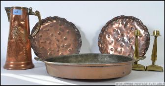 A collection of copper to include a 19th century copper and brass handled pan along with other
