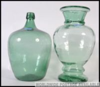 A decorative continental olive jar of bulbous form with waisted neck together with another pickle