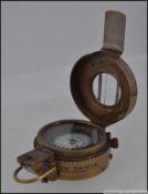 A military style brass prismatic compass,