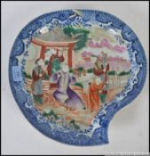 A Chinese famille rose blue and white unusual shaped bowl with central court / people scenes to