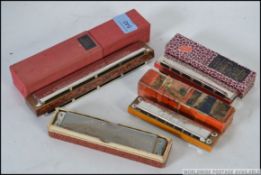 A collection of four Harmonica's all by Hohner and all with original boxes to include 2 x Echo,