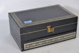 A good quality black tooled leather jewellery box with key and lock having metamorphic action with