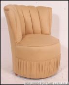 A retro 1950's fan back upholstered boudoir chair having ribbed back over circular seat with good
