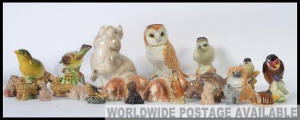 A collection of 20th century ceramic animal and bird figures to include ones by Beswick, Wade,