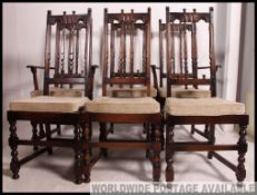 A set of 6 Ercol Colonial dining chairs having tall carved back rests with padded seats.