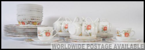 A retro Pyrex style part dinner service consisting of plates,