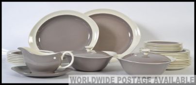 A retro Wedgwood dinner service comprising plates, platters, gravy boat etc.