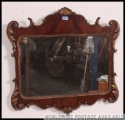 A Victorian flame mahogany and gilt rococo pier mirror.