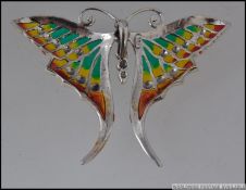 A silver and plique a jour butterfly brooch