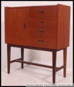 A good 1970's retro teak wood Danish influence side cabinet chest of angular form raised on tapered