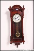 A good quality mahogany cased regulator wall clock by highlander.