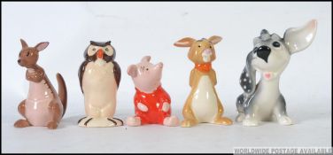 A collection of 4 Beswick figurines to include a Winnie THe Pooh together with a Goebels West