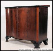 A 19th century serpentine fronted mahogany sideboard / cabinet.