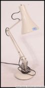 A vintage Herbert Terry anglepoise lamp in white having terraced base and pendant shade