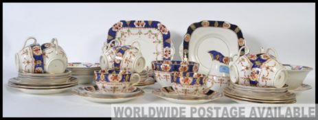 A vintage early 20th century bone china tea service in an Imari pattern by Stanley to include tea