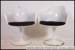 A rare pair of original Eero Saarinen ' tulip ' chairs designed in 1956 for Knoll International.