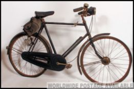 A vintage early 20th century gentlemans bicycle having leather ' Terry ' Saddle