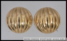 A pair of 9ct gold clip on earings in the shape of a shell. (ct import mark to verso clip with 375.