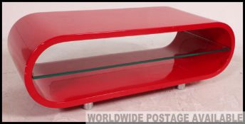 A retro style contemporary red laquered glass and chrome tv stand - side cabinet.