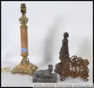 A marble and brass table lamp, Cow and Gate milkmaid dairy figure,