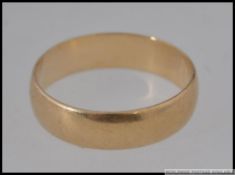 A 9ct gold gentlemans band ring being hallmarked with makers initials illegible, marked 375.