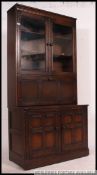 An Ercol upright colonial beech and elm dresser / cabinet.