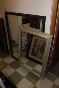 A large 20th century Victorian style ebonised wall mirror having scalloped edge design together