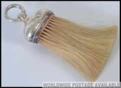 A silver hallmarked table brush with Cherub decoration,