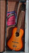 A 1950's Triumphator Spanish acoustic guitar in the original blue case ( see illustrations )